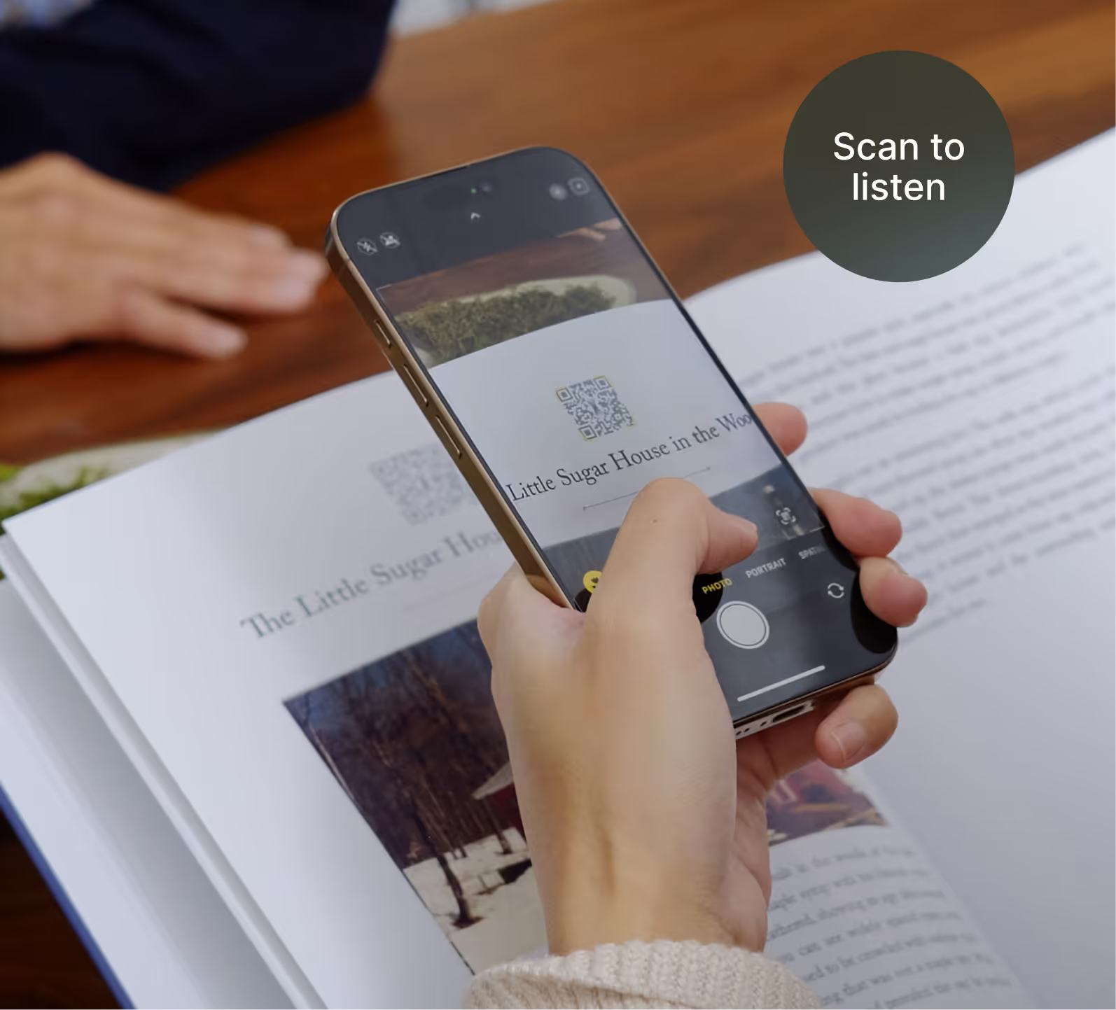 A phone scans a QR code on a Remento page to play the original recording.