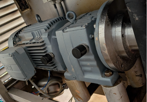 An industrial motor illustrates the physical equipment behind IntelliAM’s monitoring workflow.